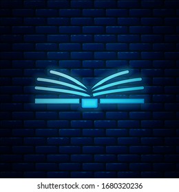 Icono de libro de neón brillante abierto aislado en fondo de pared de ladrillo. Ilustración vectorial