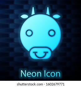 Glowing neon Ox zodiac sign icon isolated on brick wall background. Astrological horoscope collection.  Vector Illustration