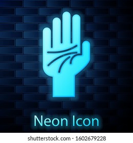 Glowing neon Palmistry of the hand icon isolated on brick wall background.  Vector Illustration