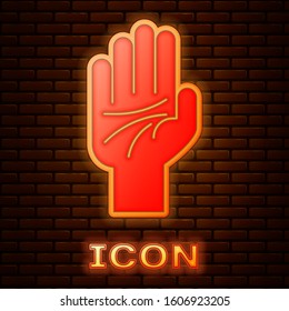 Glowing neon Palmistry of the hand icon isolated on brick wall background.  Vector Illustration