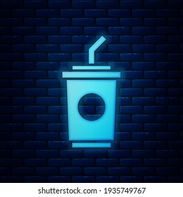 Glowing neon Paper glass with drinking straw and water icon isolated on brick wall background. Soda drink glass. Fresh cold beverage symbol.  Vector