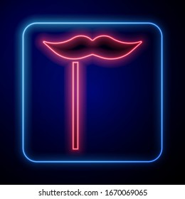 Glowing neon Paper mustache on stick icon isolated on blue background. Concept with cardboard carnival mask. Mask for a photo shoot.  Vector Illustration