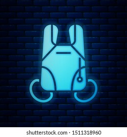 Glowing neon Parachute icon isolated on brick wall background. Extreme sport. Sport equipment.  Vector Illustration