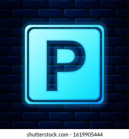 Glowing neon Parking sign icon isolated on brick wall background. Street road sign.  Vector Illustration
