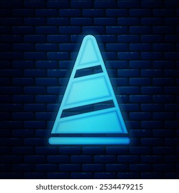 Glowing neon Party hat icon isolated on brick wall background. Birthday hat. Merry Christmas and Happy New Year.  Vector