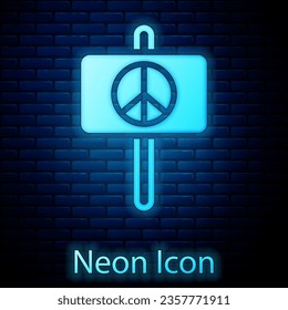 Glowing neon Peace icon isolated on brick wall background. Hippie symbol of peace.  Vector