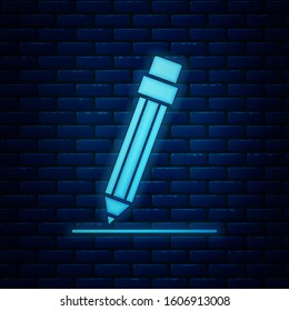Glowing neon Pencil with eraser and line icon isolated on brick wall background. Education sign. Drawing and educational tools.  Vector Illustration