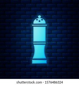 Glowing neon Pepper icon isolated on brick wall background. Cooking spices.  Vector Illustration