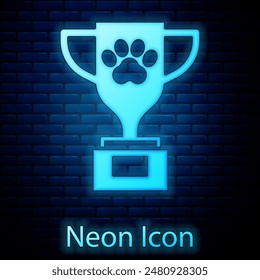 Glowing neon Pet award symbol icon isolated on brick wall background. Medal with dog footprint as pets exhibition winner concept.  Vector