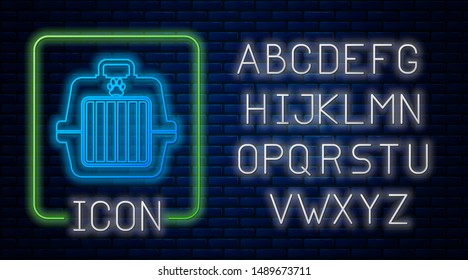 Glowing neon Pet carry case icon isolated on brick wall background. Carrier for animals, dog and cat. Container for animals. Animal transport box. Neon light alphabet. Vector Illustration