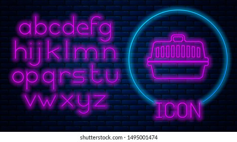 Glowing neon Pet carry case icon isolated on brick wall background. Carrier for animals, dog and cat. Container for animals. Animal transport box. Neon light alphabet. Vector Illustration