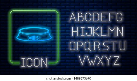Glowing neon Pet food bowl for cat or dog icon isolated on brick wall background. Fish skeleton sign. Neon light alphabet. Vector Illustration