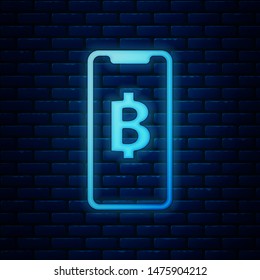 Glowing neon Phone mobile and cryptocurrency coin Bitcoin icon isolated on brick wall background. Physical bit coin. Blockchain based secure crypto currency.  Vector Illustration