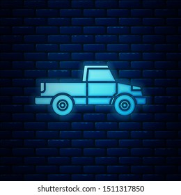 Glowing neon Pickup truck icon isolated on brick wall background.  Vector Illustration