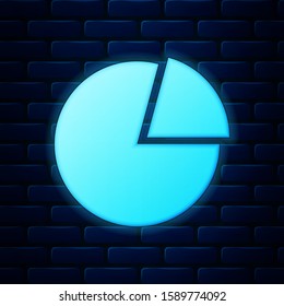 Glowing neon Pie chart infographic icon isolated on brick wall background. Presentation graph sign. Diagram chart sign. Market analytics symbol.  Vector Illustration