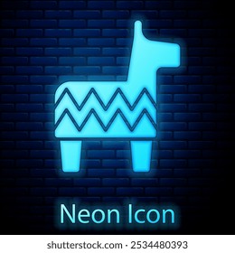 Glowing neon Pinata icon isolated on brick wall background. Mexican traditional birthday toy.  Vector