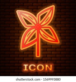 Glowing neon Pinwheel icon isolated on brick wall background. Windmill toy icon.  Vector Illustration