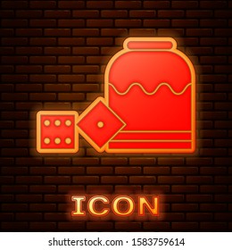 Glowing neon Pirate game dice icon isolated on brick wall background. Casino gambling.  Vector Illustration