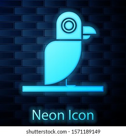 Glowing neon Pirate parrot icon isolated on brick wall background.  Vector Illustration