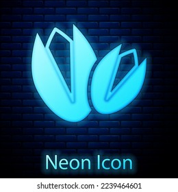 Glowing neon Pistachio nuts icon isolated on brick wall background.  Vector