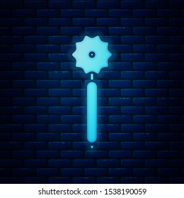 Glowing neon Pizza knife icon isolated on brick wall background. Pizza cutter sign. Steel kitchenware equipment.  Vector Illustration