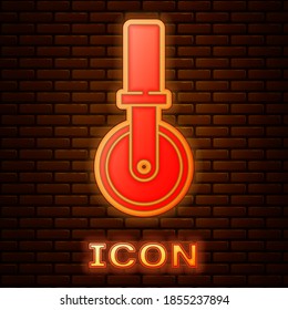Glowing neon Pizza knife icon isolated on brick wall background. Pizza cutter sign. Steel kitchenware equipment. Vector.