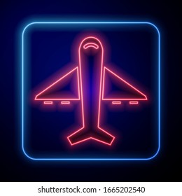 Glowing neon Plane icon isolated on blue background. Flying airplane icon. Airliner sign.  Vector Illustration
