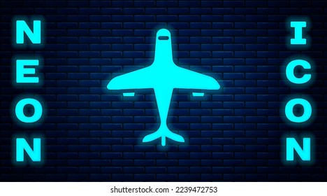 Glowing neon Plane icon isolated on brick wall background. Flying airplane icon. Airliner sign.  Vector