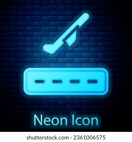 Glowing neon Plane takeoff icon isolated on brick wall background. Airplane transport symbol.  Vector