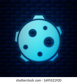 Glowing neon Planet icon isolated on brick wall background.  Vector Illustration