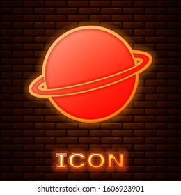 Glowing neon Planet Saturn with planetary ring system icon isolated on brick wall background.  Vector Illustration