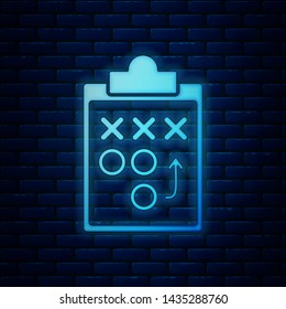 Glowing neon Planning strategy concept icon isolated on brick wall background. Soccer or american football cup formation and tactic.  Vector Illustration