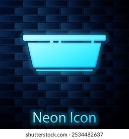 Glowing neon Plastic basin icon isolated on brick wall background. Bowl with water. Washing clothes, cleaning equipment.  Vector Illustration