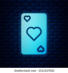 Glowing neon Playing card with heart symbol icon isolated on brick wall background. Casino gambling.  Vector Illustration