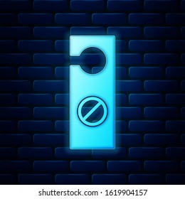 Glowing neon Please do not disturb icon isolated on brick wall background. Hotel Door Hanger Tags.  Vector Illustration