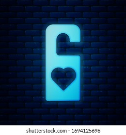 Glowing neon Please do not disturb with heart icon isolated on brick wall background. Hotel Door Hanger Tags.  Vector Illustration