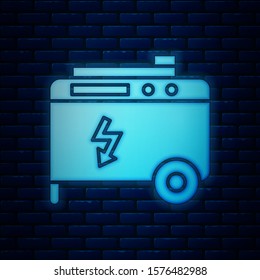 Glowing neon Portable power electric generator icon isolated on brick wall background. Industrial and home immovable power generator.  Vector Illustration