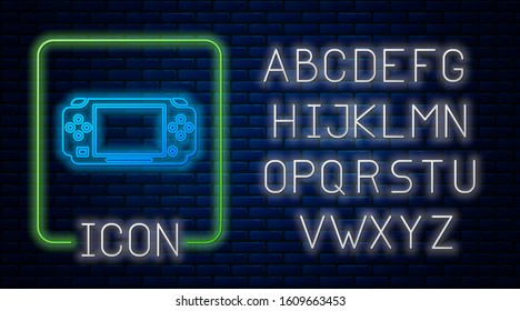 Glowing neon Portable video game console icon isolated on brick wall background. Gamepad sign. Gaming concept. Neon light alphabet. Vector Illustration