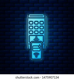 Glowing neon POS terminal with printed reciept and confirms the payment by smartphone icon isolated on brick wall background. NFC payment concept.  Vector Illustration