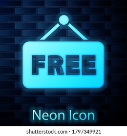 Glowing neon Price tag with an inscription Free icon isolated on brick wall background. Badge for price. Promo tag discount. Vector Illustration