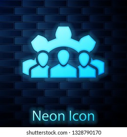 Glowing neon Project team base icon isolated on brick wall background. Business analysis and planning, consulting, team work, project management. Developers. Vector Illustration