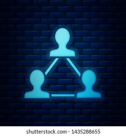 Glowing neon Project team base icon isolated on brick wall background. Business analysis and planning, consulting, team work, project management. Developers.  Vector Illustration