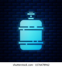 Glowing neon Propane gas tank icon isolated on brick wall background. Flammable gas tank icon.  Vector Illustration