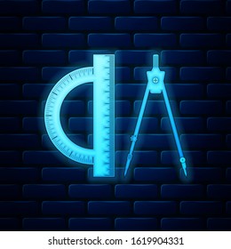 Glowing neon Protractor and drawing compass icon isolated on brick wall background. Drawing professional instrument. Geometric equipment. Education sign.  Vector Illustration