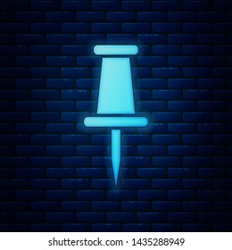 Glowing neon Push pin icon isolated on brick wall background. Thumbtacks sign.  Vector Illustration
