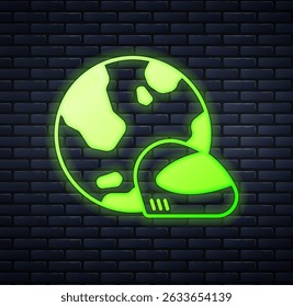 Glowing neon Racing helmet icon isolated on brick wall background. Extreme sport. Sport equipment.  Vector