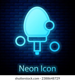 Glowing neon Racket for playing table tennis icon isolated on brick wall background.  Vector