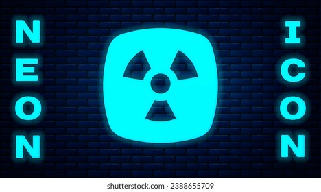 Glowing neon Radioactive icon isolated on brick wall background. Radioactive toxic symbol. Radiation hazard sign.  Vector