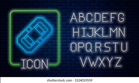 Glowing neon Rafting boat icon isolated on brick wall background. Inflatable boat. Water sports, extreme sports, holiday, vacation, team building. Neon light alphabet. Vector Illustration
