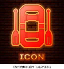 Glowing neon Rafting boat icon isolated on brick wall background. Inflatable boat with oars. Water sports, extreme sports, holiday, vacation, team building.  Vector Illustration